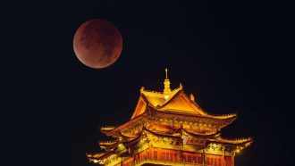 JIUJIANG, CHINA - SEPTEMBER 08: (EDITOR'S NOTE: Image taken with double exposure) A total lunar eclipse cast a "blood moon" over the night sky on September 8, 2025 in Jiujiang, Jiangxi Province of China. Astronomers note that such total lunar eclipses, often called blood moons for their crimson hue, are visible only a few times each decade. (Photo by Shen Junfeng/VCG via Getty Images)