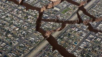Aerial view of a city with cracks and crevices from an earthquake.