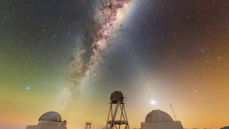 Celestial beams of light formed from both the Milky Way and zodiacal light crisscross above the telescopes of the U.S. National Science Foundation Cerro Tololo Inter-American Observatory (CTIO), a Program of NSF NOIRLab. The US Naval Observatory Deep South Telescope sits on the far left of this image. Moving towards the right, there is also the DIMM1 Seeing Monitor, the CHilean Automatic Supernova sEarch dome (CHASE), the UBC Southern Observatory, and the Planetary Defense 1.0-meter Telescope. These represent only a subset of the nearly 40 telescopes at CTIO, so this celestial X truly marks the spot of a treasure trove of discovery! Many of the telescopes pictured here have specialized purposes on behalf of their sponsors. For example, the UBC Southern Observatory 0.35-meter (1.15-foot) telescope was made specifically for the site-testing campaign of the Thirty Meter Telescope. Today, it is used by the University of British Columbia in Canada for research on transiting exoplanets and space debris. Another specialized telescope at CTIO is the Planetary Defense 1.0-meter Telescope, operated by the University of North Carolina and the Astronomical Research Institute. This telescope conducts southern-sky astrometric follow-up observations of Near-Earth Asteroids (NEAs). This photo was taken as part of the NOIRLab 2022 Photo Expedition to all the NOIRLab sites. Petr Horálek, the photographer, is a NOIRLab Audiovisual Ambassador.