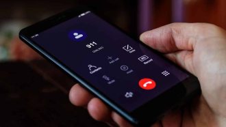 Dialing 911, call 911. Emergency concept: man using a digital phone with emergency call on the screen. All screen graphics are made up