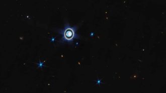 This wider view of the Uranian system with Webb’s NIRCam instrument features the planet Uranus as well as six of its 27 known moons (most of which are too small and faint to be seen in this short exposure). A handful of background objects, including many galaxies, are also seen. [Image description: The planet Uranus is on a black background just left of centre. Just below the planet at the 7 o’clock position is a faint blue point labeled Puck. Brighter blue points at 8 o’clock, 5 o’clock, and 3 o’clock are labeled Ariel, Miranda, and Umbriel, respectively. Two additional blue points at 7 o’clock and 5 o’clock are labeled Titania and Oberon]